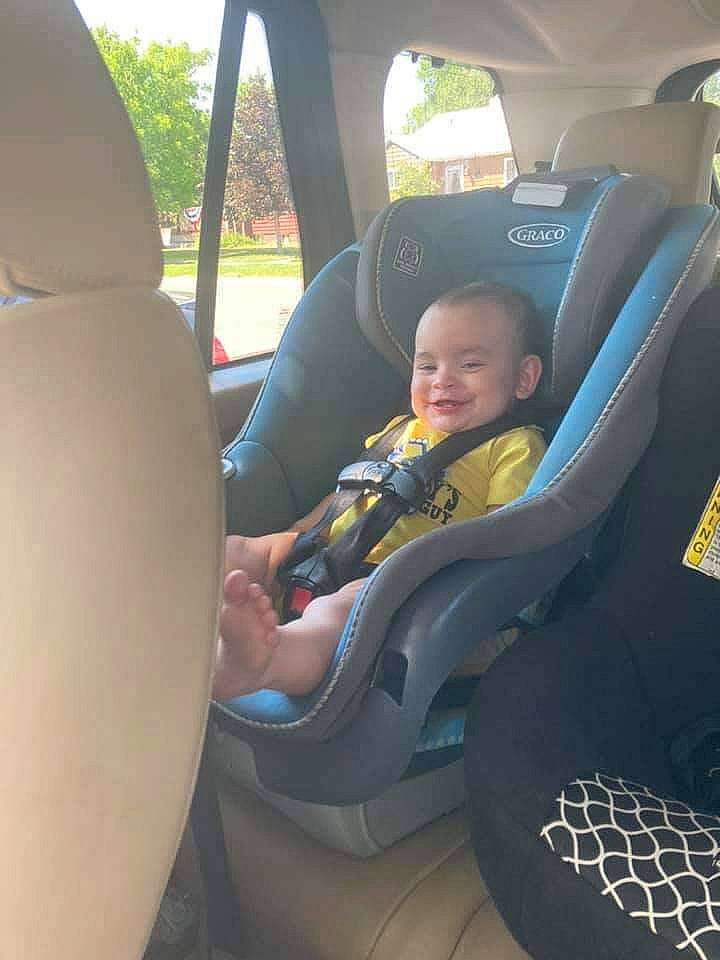 Xaiden is registered to the contest to win money with this photo: auto_part, automotive_design, automotive_exterior, car, car_seat, car_seat_cover, comfort, fun, head_restraint, joy, mode_of_transport, motor_vehicle, person, plant, seat_belt, smile, steering_part, steering_wheel, toddler, vehicle
