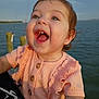toddler, child, smiling, happy, outdoor, water, sky, sunlight, cute, face, expression, clothing, person, joy, nature, daylight, portrait, ruffles, buttons, short_sleeves