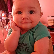 Ryder joined the competition — help win amazing prizes! baby, child, indoor, person, face, smile, cute, arm, hand, shirt, green_shirt, skin, expression, portrait, young, infant, human, head, eyes, cozy
