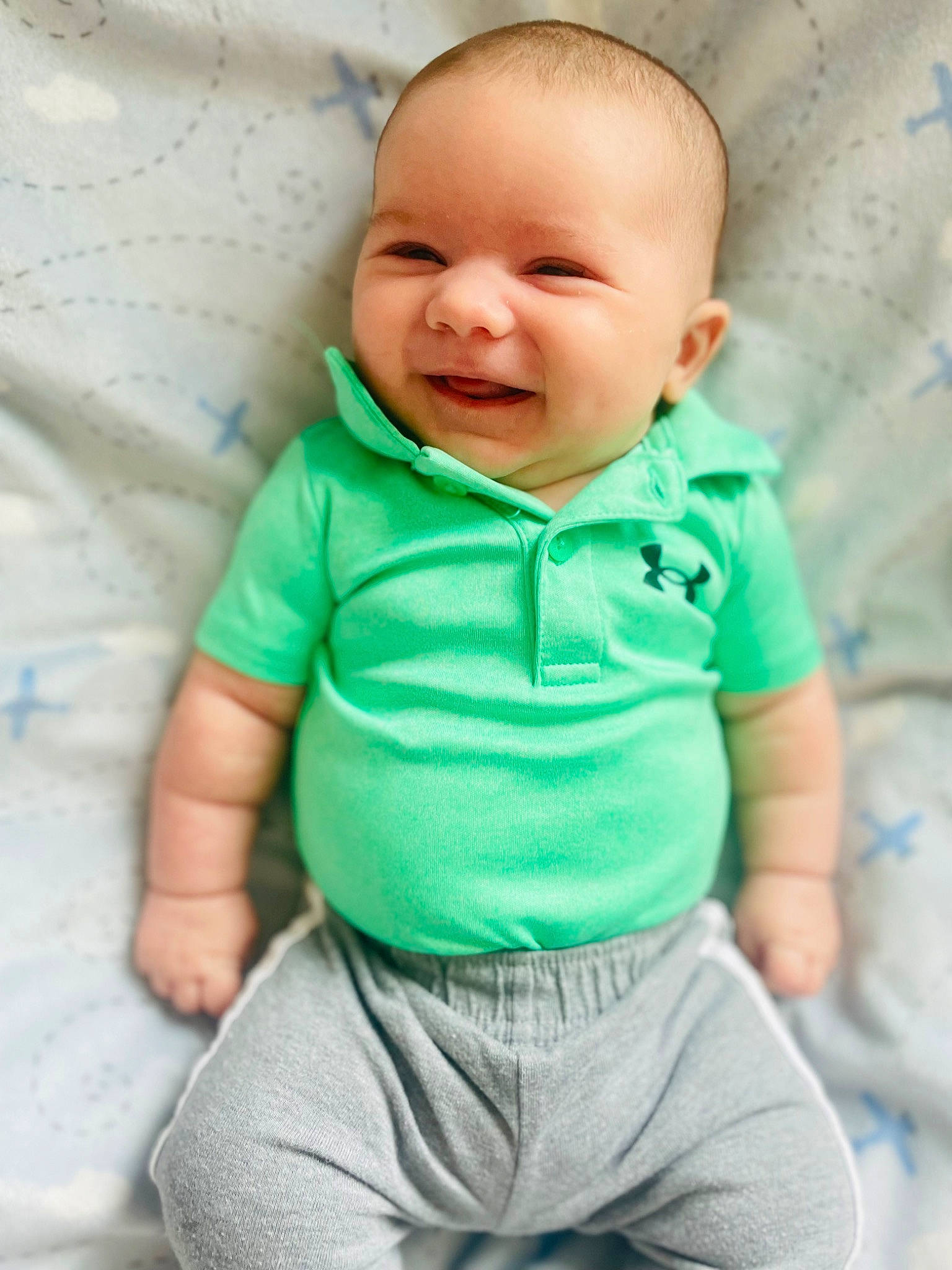Zayden is registered to the contest to win money with this photo: azure, baby, baby_toddler_clothing, cheek, child, chin, clothing, comfort, eye, face, gesture, happy, neck, nose, person, product, skin, sleeve, smile, t_shirt
