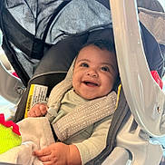 Jimma joined the competition — help win amazing prizes! baby, car_seat, smile, happy, infant, blanket, clothing, seatbelt, child, indoor, person, cute, portrait, baby_toy, car_seat_strap, head, cheerful, seat, safety, young_child