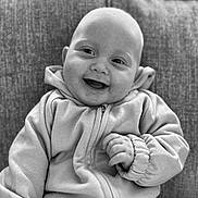 Beau joined the competition — help win amazing prizes! baby, smiling, hoodie, couch, happy, infant, portrait, black_and_white, seated, child, clothing, cozy, cute, face, expression, indoor, person, texture, young, casual
