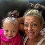 Luna is registered to the contest to win money with this photo: woman, toddler, child, smile, happy, indoors, selfie, curly_hair, blonde_hair, casual_clothing, pink_shirt, white_tank_top, couch, face, portrait, family, light, background, closeup, people