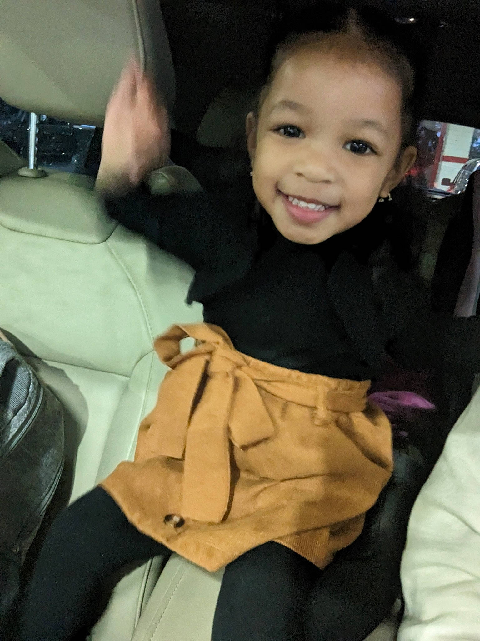 Alanna is registered to the contest to win money with this photo: auto_part, automotive_design, baby, bag, car_seat, child, comfort, family_car, finger, gesture, happy, human_leg, joy, luxury_vehicle, person, sitting, sleeve, smile, steering_wheel, thumb