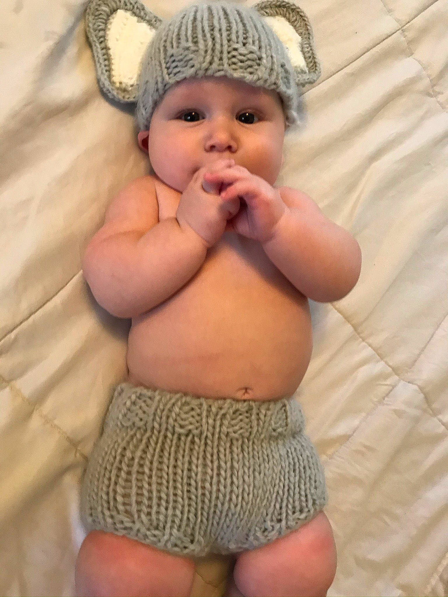 Evo is registered to the contest to win money with this photo: abdomen, arm, baby, baby_toddler_clothing, cap, chest, child, eye, head, headwear, lip, nail, person, pink, shoulder, skin, stomach, textile, thigh, thumb