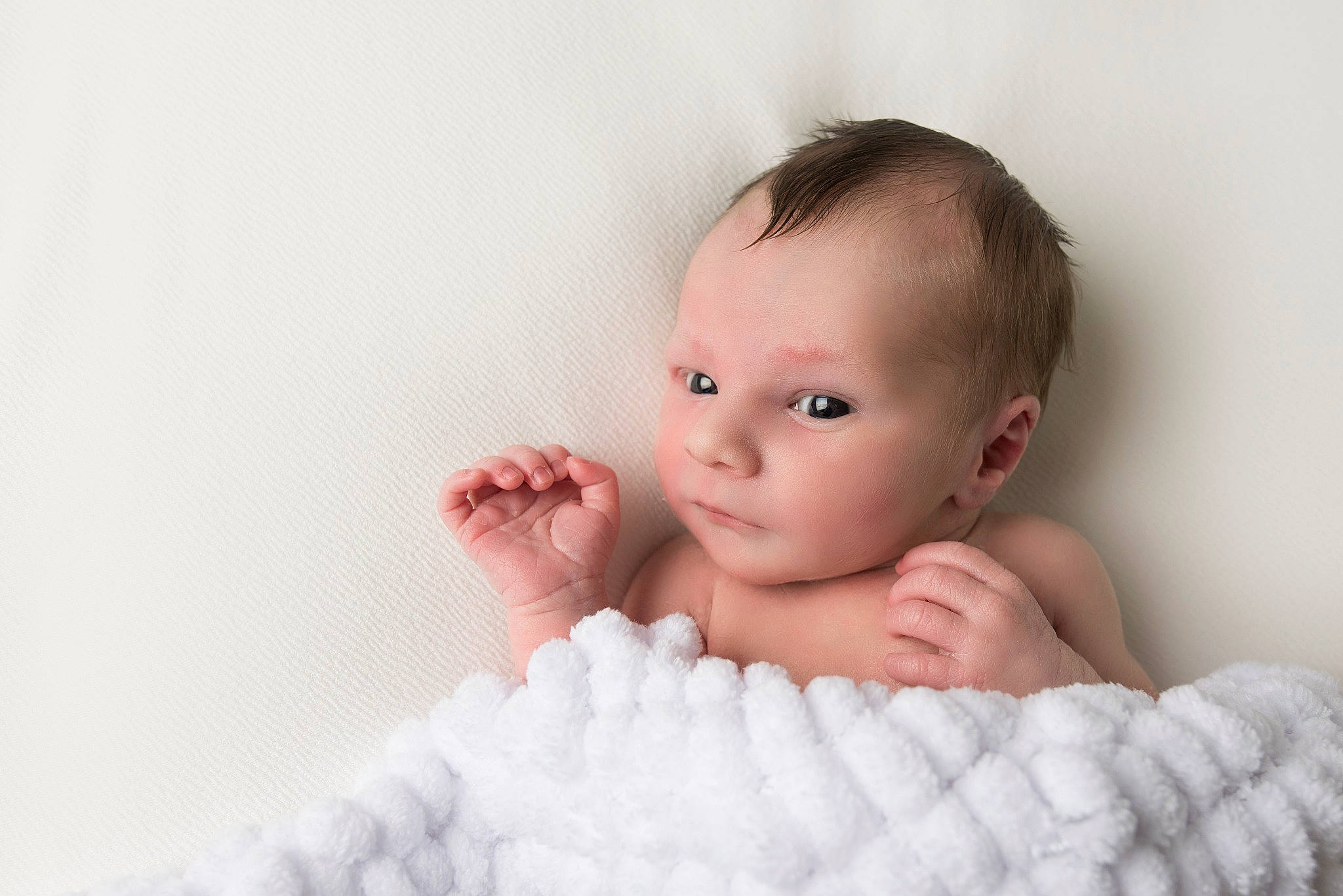 Camren is registered to the contest to win money with this photo: baby, cheek, child, close_up, eye, face, hand, head, iris, lip, mouth, nose, organ, person, photograph, photography, pink, room, skin, toddler
