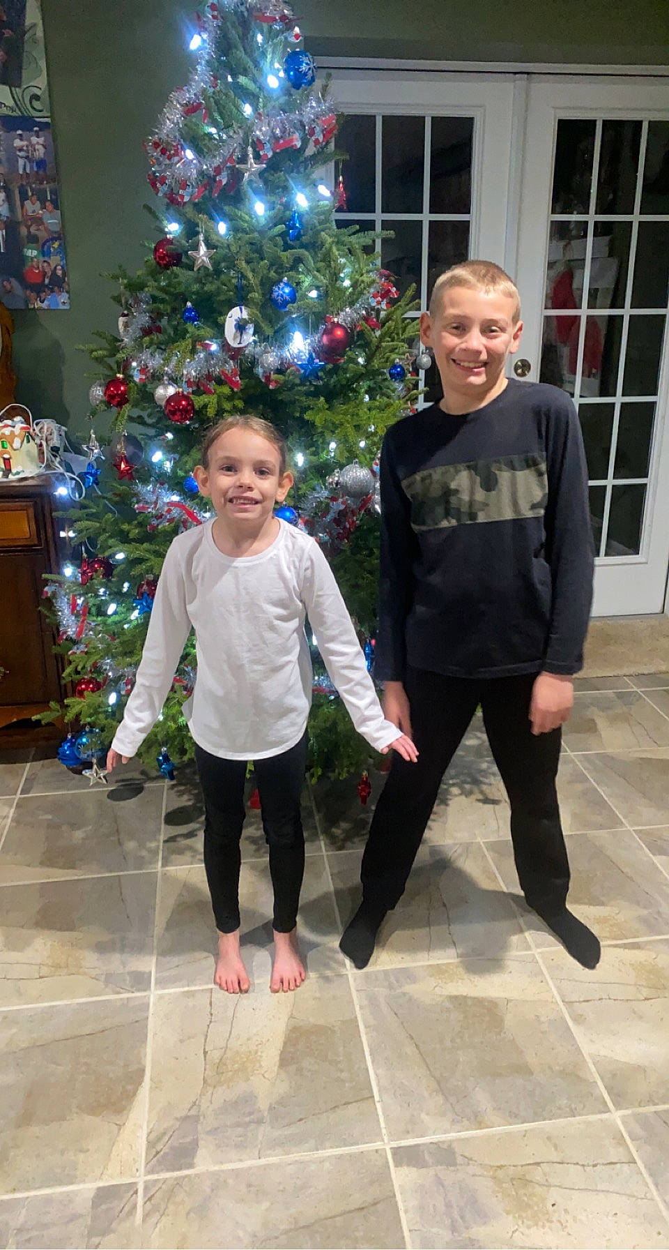 Natalee joined the competition — help win amazing prizes! christmas, christmas_decoration, christmas_eve, christmas_ornament, christmas_tree, event, evergreen, facial_expression, flooring, fun, happy, head, holiday, holiday_ornament, human_body, joy, leg, ornament, person, smile