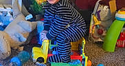 Hezekiah is registered to the contest to win money with this photo: architecture, baby, ball, building, couch, face, football, furniture, happy, head, indoors, laughing, livingroom, person, photography, playarea, portrait, room, sphere, toy