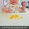 baby, child, curious, expression, face, feeding, food, foot, furniture, hands, helmet, high_chair, home, indoor, meal_time, onesie, protective_gear, scrambled_eggs, toddler, wood_floor