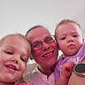 baby, casual, child, children, closeup, family, glasses, happy, headshot, indoor, light_background, people, pink_shirt, portrait, purple_shirt, selfie, smile, toddler, watch, woman