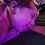 baby, face, child, closeup, purple_light, resting, person, skin, clothing, cozy, comfort, young, infant, head, ear, sleepy, portrait, indoor, people, warm