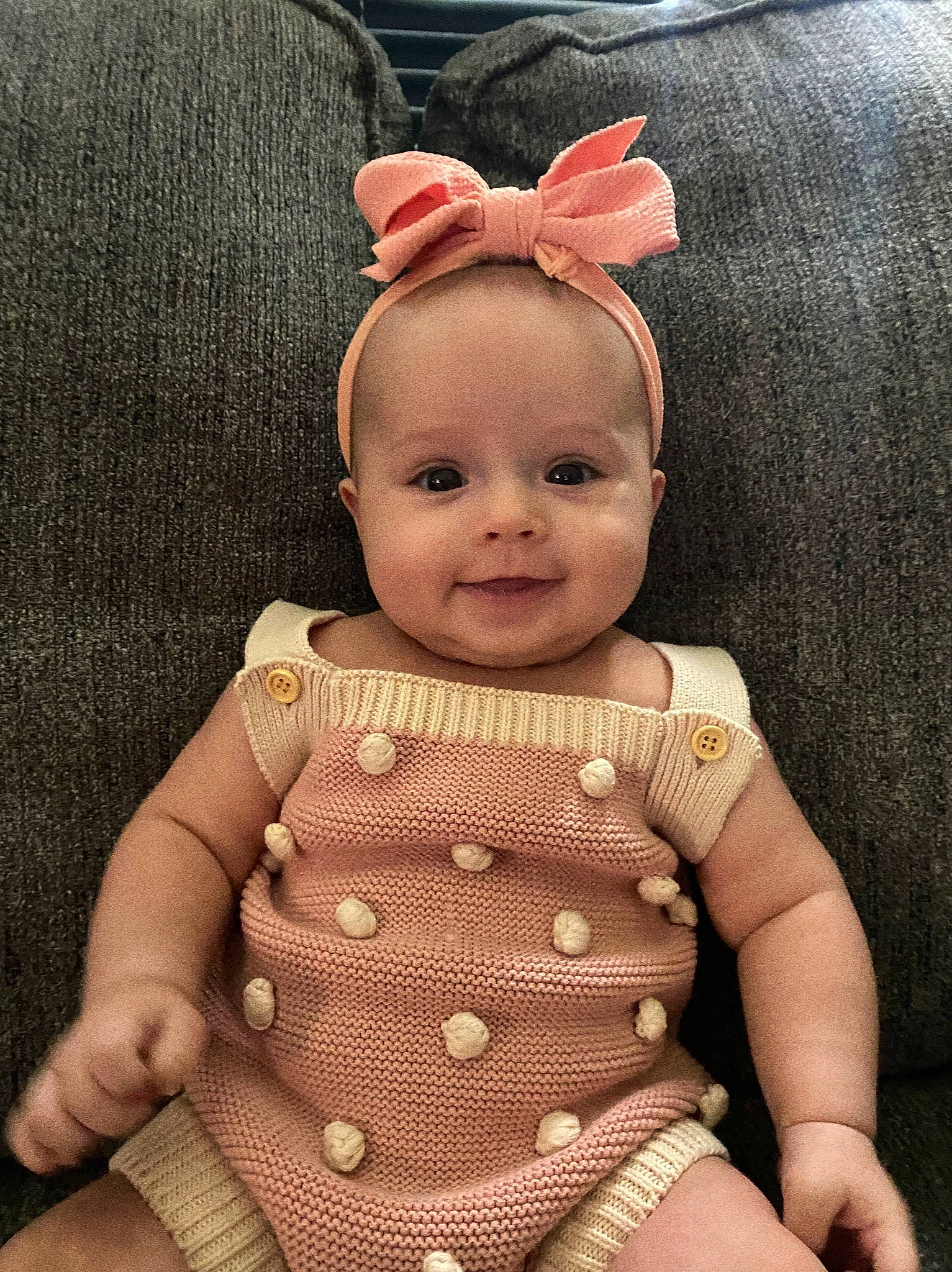 Aulani is registered to the contest to win money with this photo: baby, baby_toddler_clothing, cheek, chest, child, chin, doll, dress, eye, happy, head, human_body, joy, lip, person, pink, skin, sleeve, textile, toddler