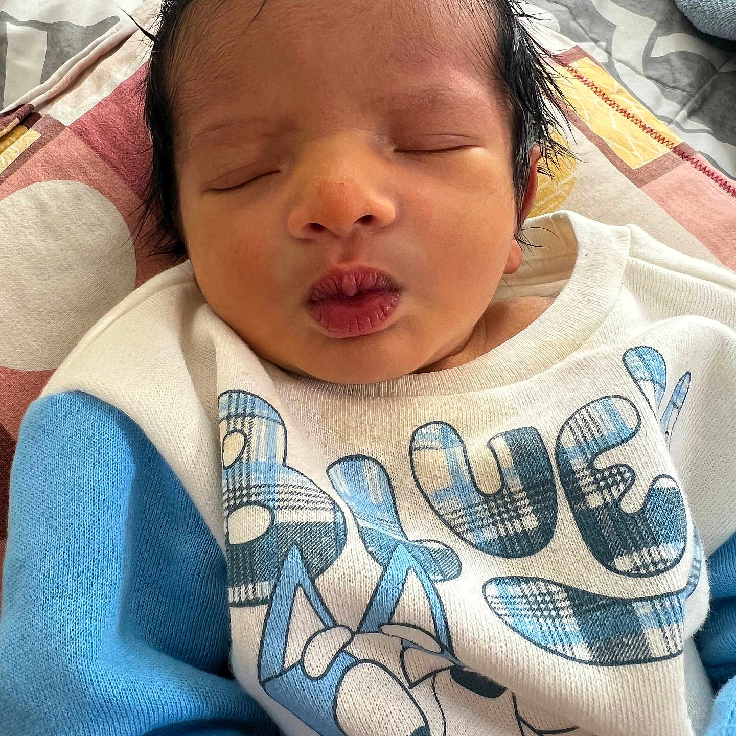 Vakul is registered to the contest to win money with this photo: baby, bed, bedroom, blanket, clothing, cushion, face, furniture, glove, head, homedecor, indoors, newborn, person, photography, portrait, quilt, sleeping, t_shirt, towel