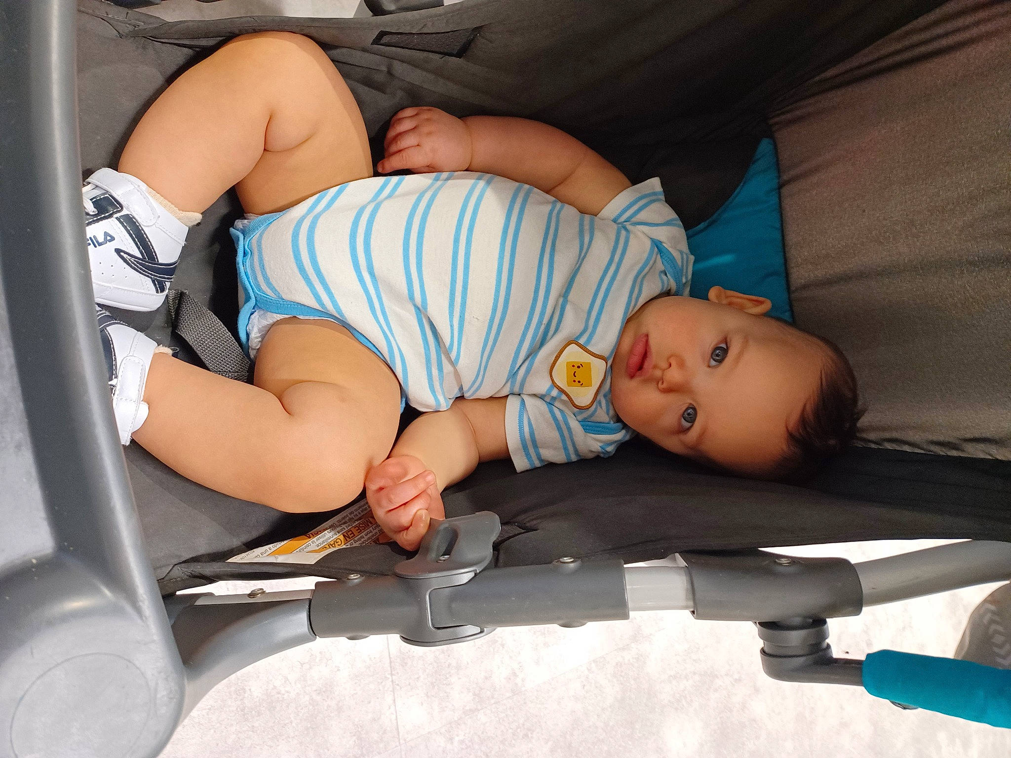 Zakariya is registered to the contest to win money with this photo: abdomen, arm, baby, baby_products, baby_sleeping, baby_toddler_clothing, child, comfort, finger, hat, human_leg, joint, knee, lap, leg, muscle, person, shorts, thigh, toddler