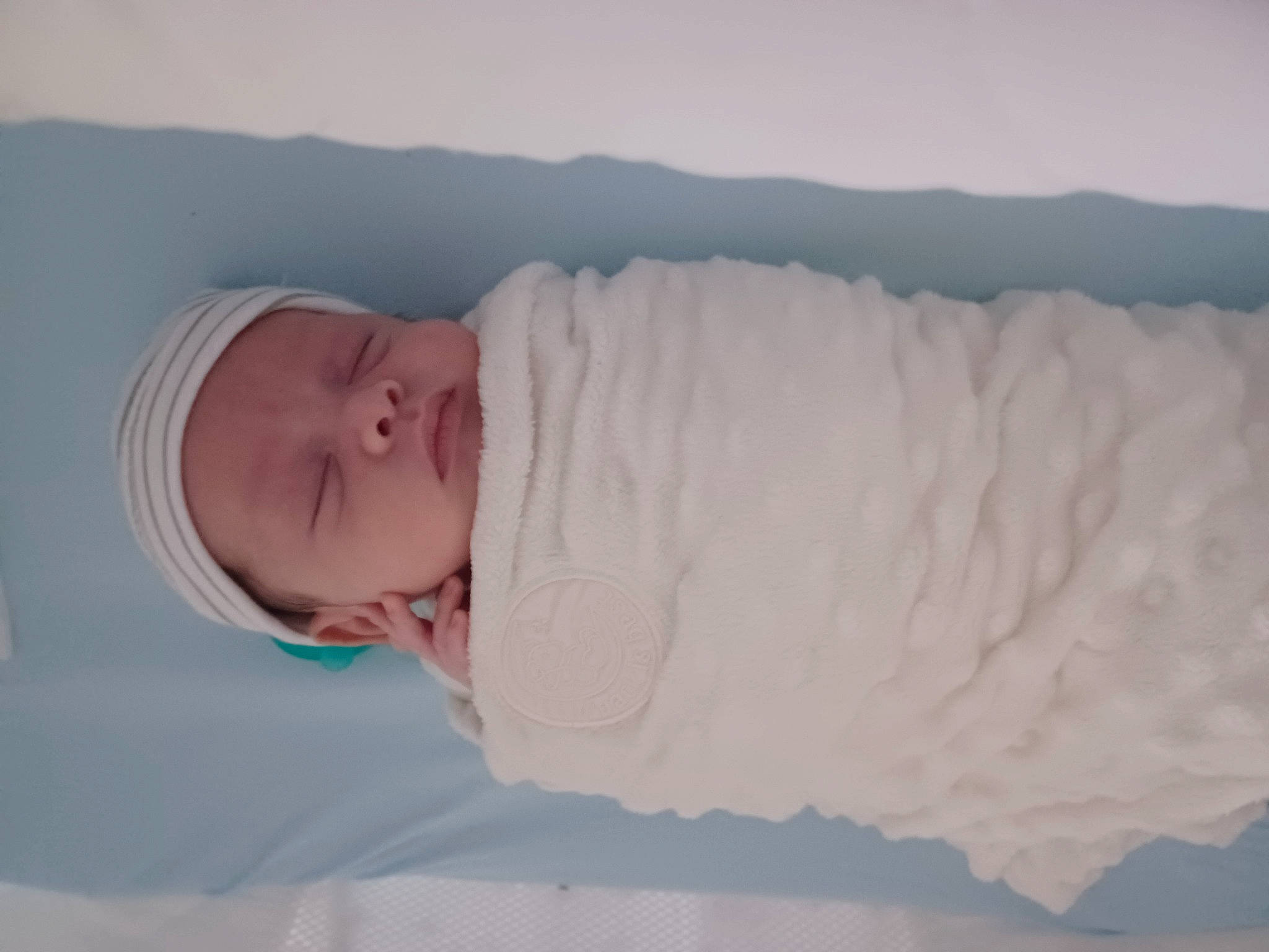 Zakaria is registered to the contest to win money with this photo: baby, baby_sleeping, baby_toddler_clothing, bedding, bedtime, cheek, child, comfort, fur, head, headgear, headwear, linens, nap, nose, person, room, skin, sleep, sleeve