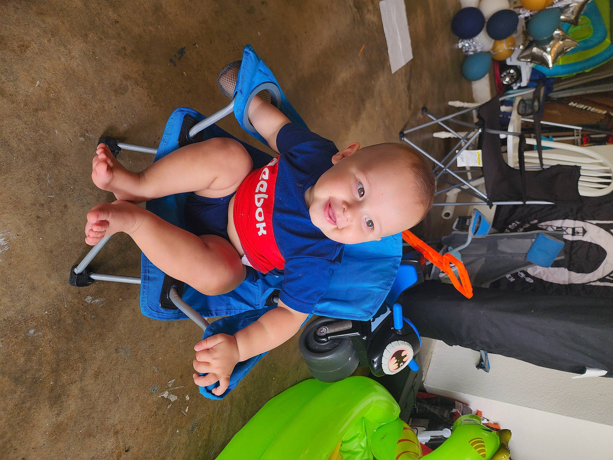 Easton joined the competition — help win amazing prizes! baby, child, elbow, electric_blue, fun, green, hat, human_leg, joy, knee, leisure, person, personal_protective_equipment, recreation, shorts, sitting, smile, sneakers, thigh, tire