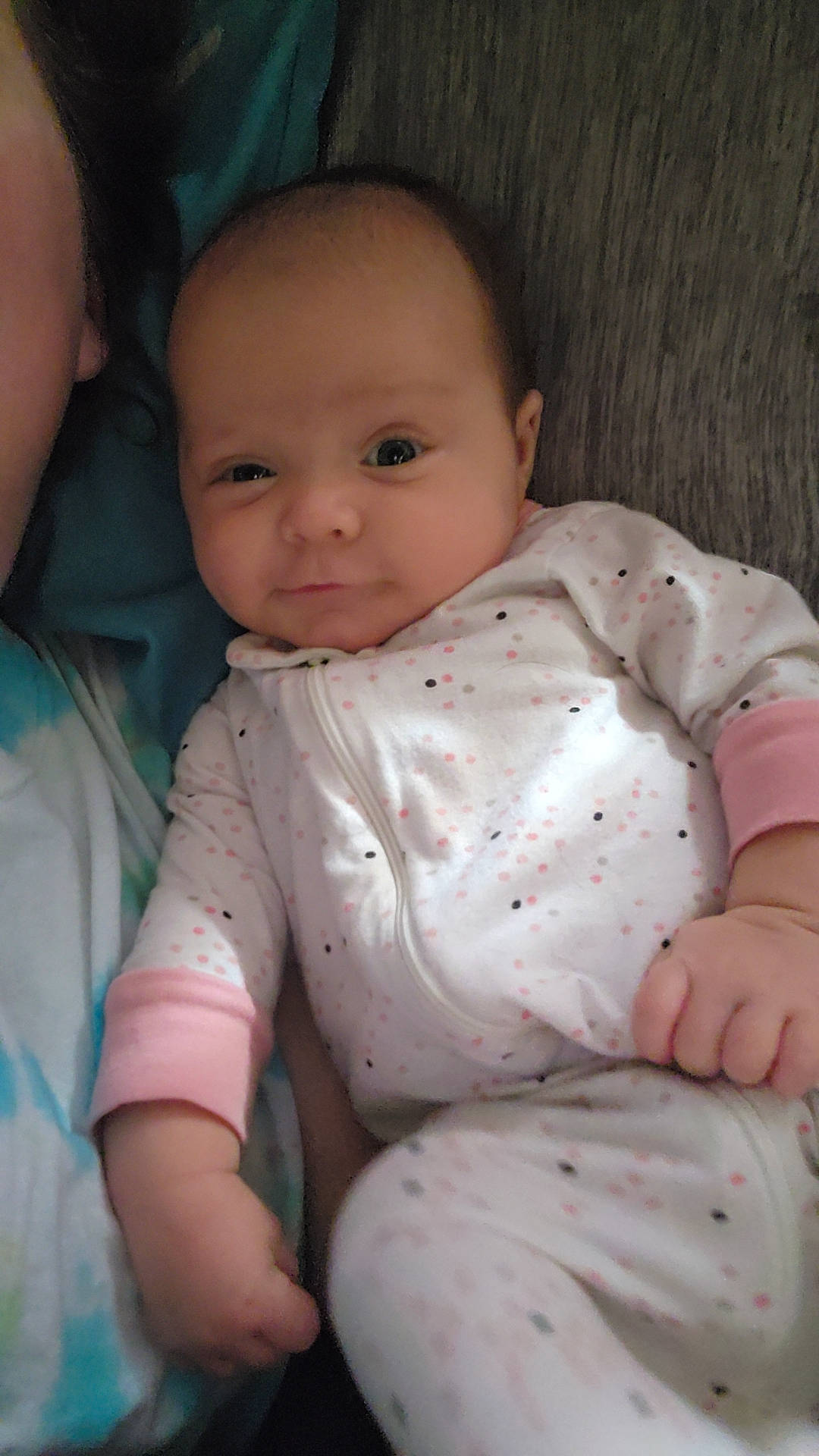 Delilah is registered to the contest to win money with this photo: baby, baby_toddler_clothing, cheek, comfort, eye, finger, gesture, happy, head, iris, lip, mammal, mouth, nose, person, skin, sleeve, smile, textile, thumb