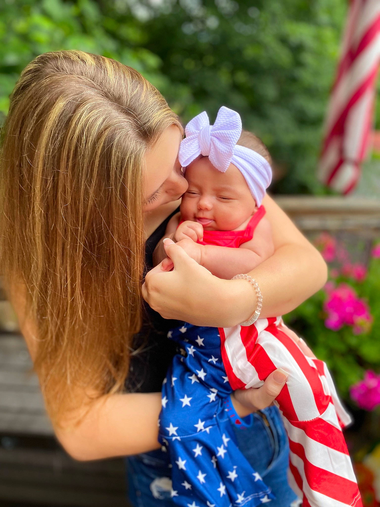 Bristol is registered to the contest to win money with this photo: baby, baby_toddler_clothing, beauty, cap, finger, flag, fun, gesture, grass, happy, hat, headwear, leisure, people_in_nature, person, pink, plant, skin, smile, sun_hat