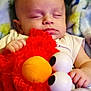 Miles joined the competition — help win amazing prizes! baby, sleeping, plush_toy, elmo, red, blanket, soft, infant, cute, peaceful, child, hand, face, closed_eyes, cozy, comfort, indoors, resting, toddler, cuddly