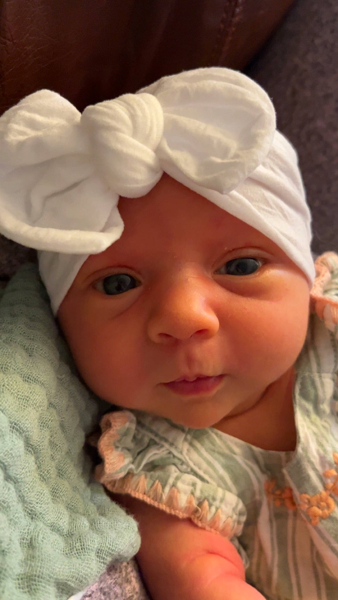 Annie is registered to the contest to win money with this photo: baby, baby_toddler_clothing, cap, cheek, chin, eye, eyebrow, happy, hat, headgear, headwear, human_body, iris, lip, mouth, nose, outerwear, person, skin, sleeve