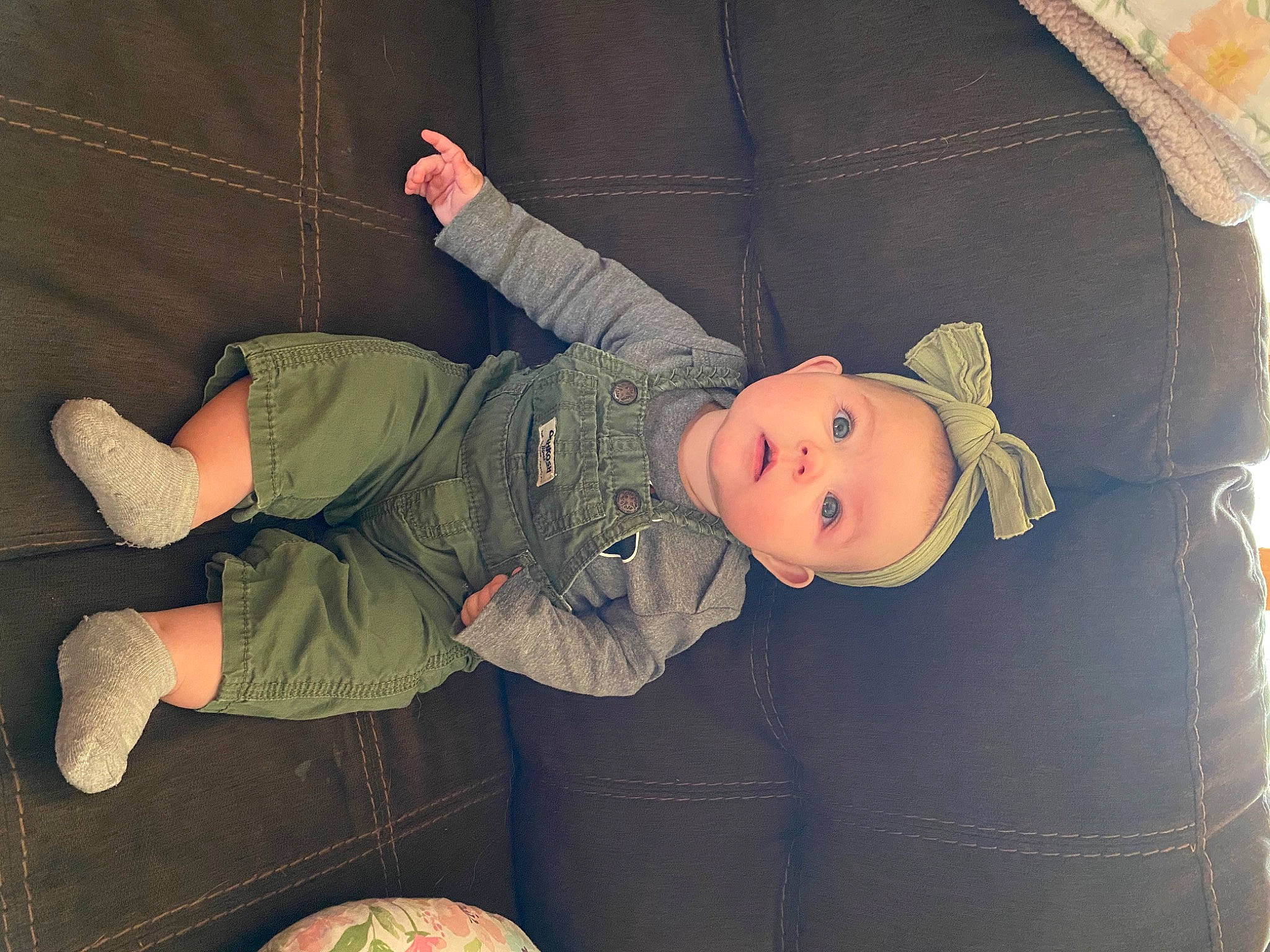 Aubrey is registered to the contest to win money with this photo: baby, baby_products, baby_toddler_clothing, cheek, child, comfort, couch, fun, hat, lap, linens, pattern, person, room, sitting, sleeve, smile, sock, textile, toddler