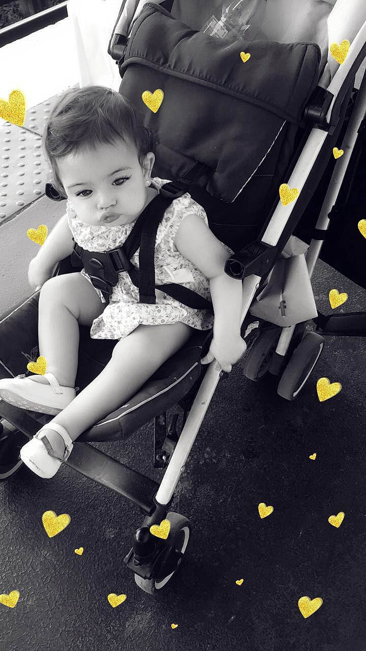 Kahina Emilie a rejoint le concours — aidez-le/la à gagner de superbes lots ! baby_carriage, child, games, person, photography, play, product, smile, toddler, yellow