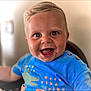 toddler, child, smiling, blue_shirt, crocodile_print, happy, face, portrait, short_hair, indoor, baby, cute, cheerful, person, young_child, closeup, sitting, expression, playful, bright_eyes