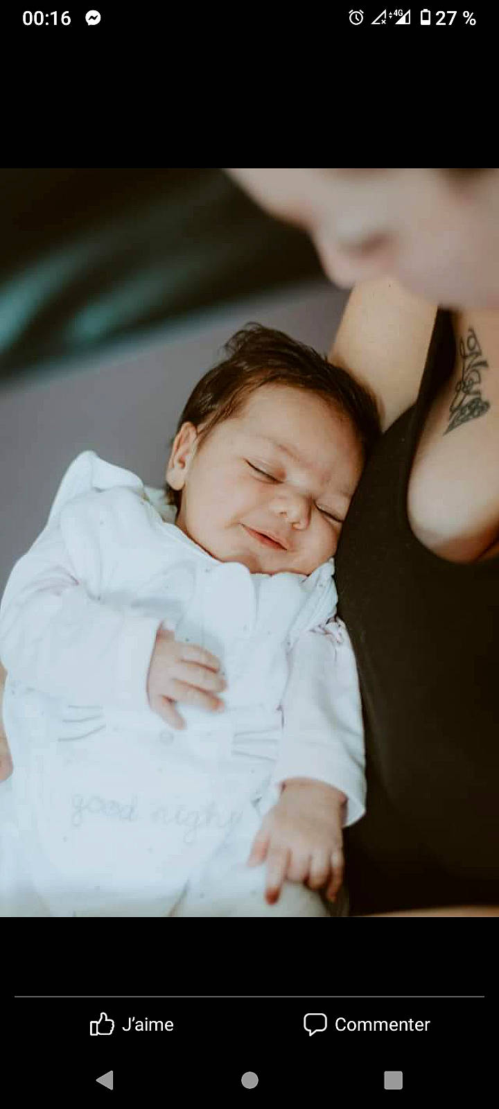 Mina participe au concours pour gagner de l'argent avec cette photo : baby, baby_toddler_clothing, cheek, child, comfort, elbow, finger, flash_photography, fun, gesture, happy, linens, person, portrait_photography, room, sitting, skin, sleeve, smile, thumb