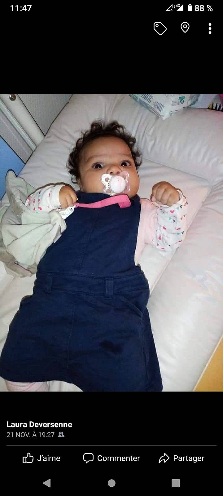 Mina participe au concours pour gagner de l'argent avec cette photo : arm, baby, baby_toddler_clothing, cheek, comfort, eye, face, finger, flash_photography, gesture, hair, hand, head, linens, mouth, nose, person, skin, sleeve, textile