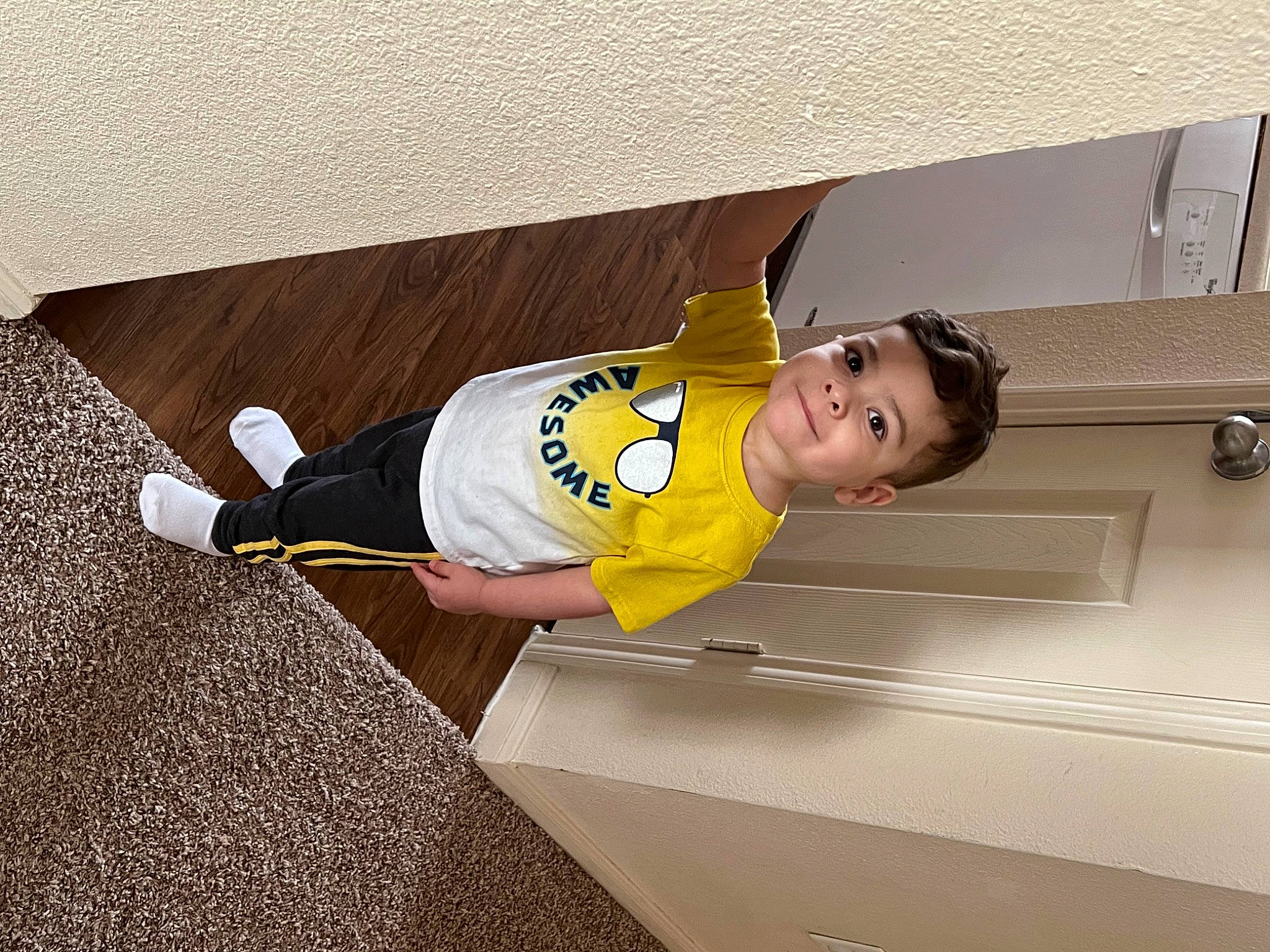 Brayden joined the competition — help win amazing prizes! baby_toddler_clothing, child, elbow, flooring, hat, joy, person, room, sleeve, smile, sportswear, t_shirt, toddler, wood