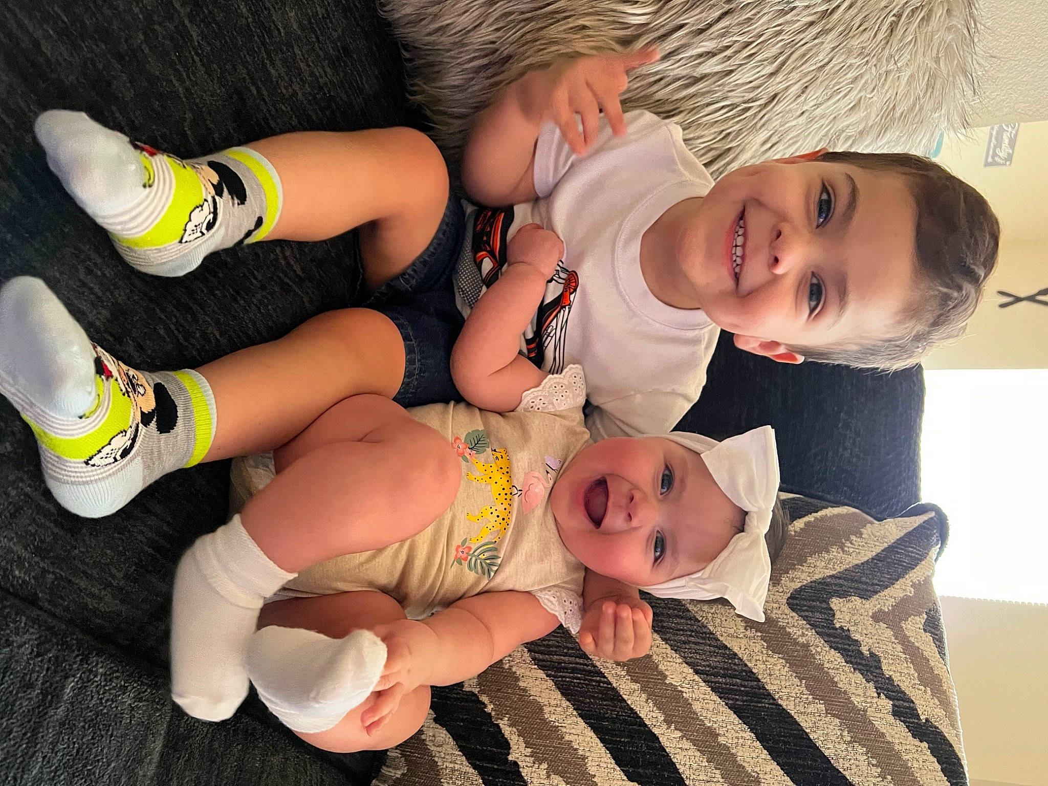 Brayden joined the competition — help win amazing prizes! baby, baby_toddler_clothing, comfort, facial_expression, finger, foot, happy, head, headwear, human_leg, joy, knee, leg, person, skin, sleeve, smile, sock, thigh, thumb