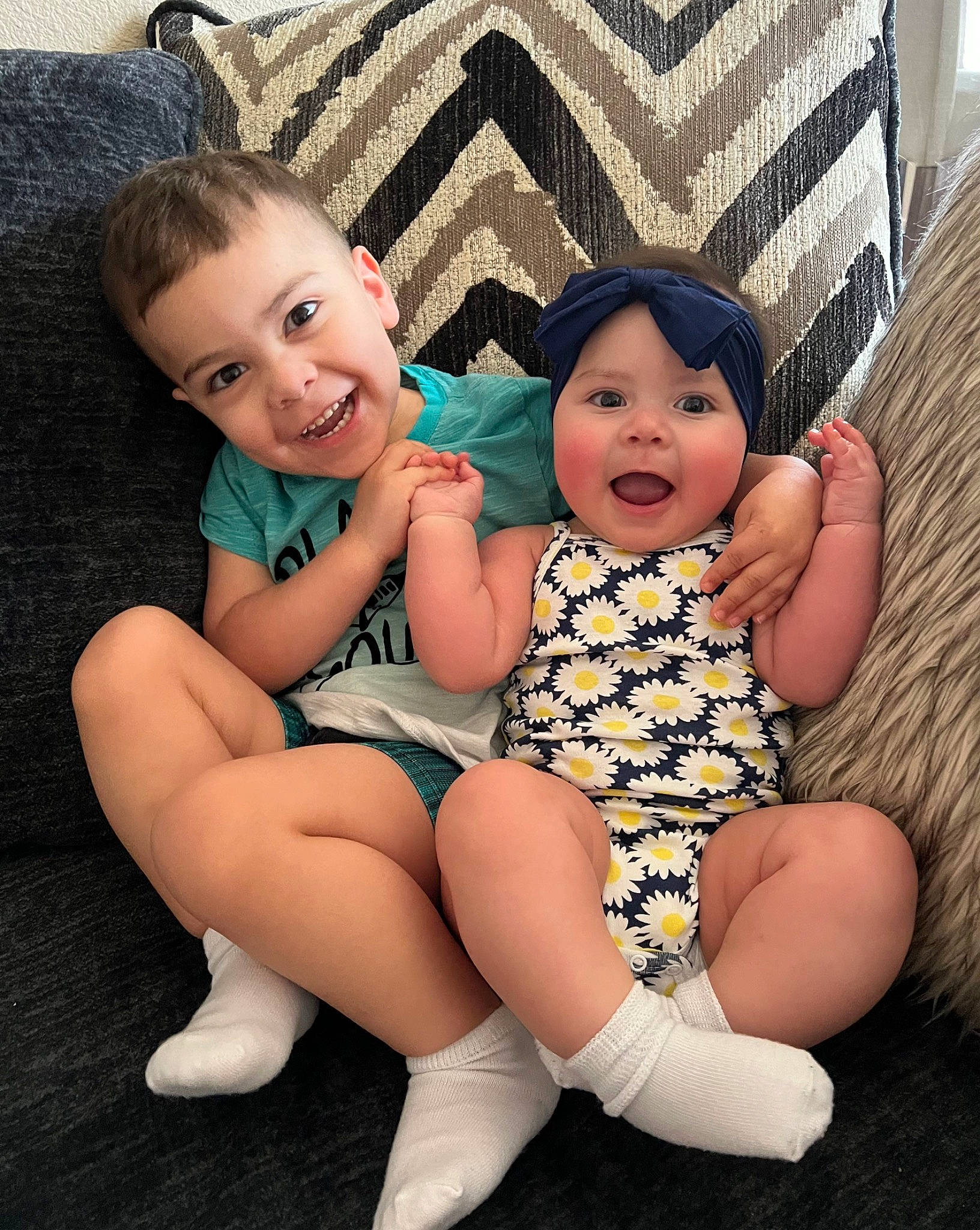 Brayden is registered to the contest to win money with this photo: baby, baby_toddler_clothing, comfort, eye, face, finger, flash_photography, happy, head, headwear, human_body, iris, joy, lap, leg, mouth, person, skin, smile, standing