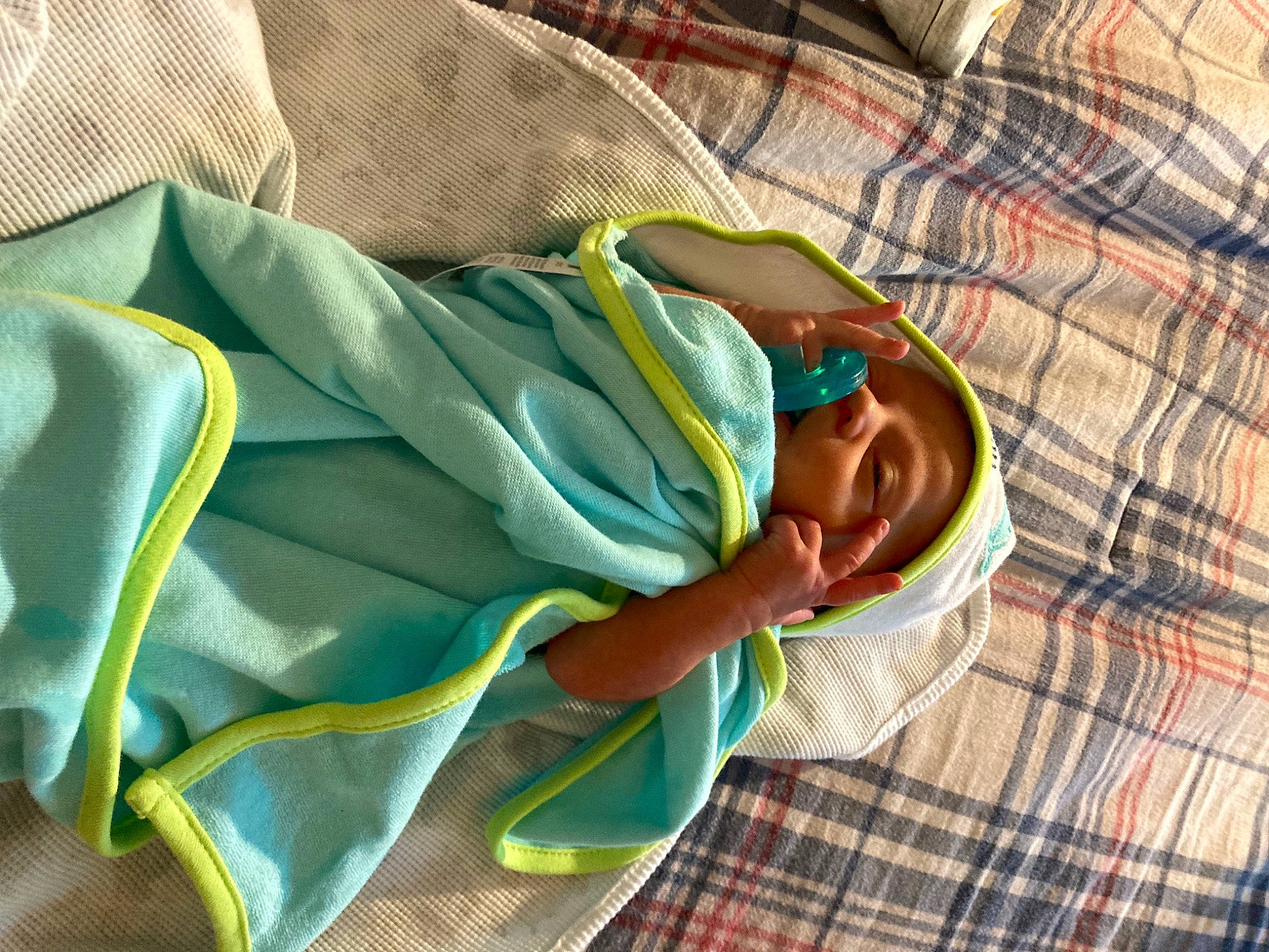 Jermaine is registered to the contest to win money with this photo: baby, baby_products, baby_safety, baby_sleeping, baby_toddler_clothing, bedding, bedtime, child, comfort, green, head, human_body, infant_bed, leisure, linens, pattern, person, plaid, room, textile