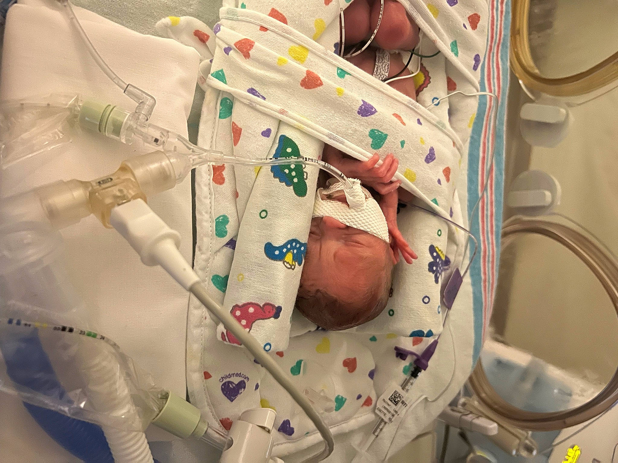 Cohen is registered to the contest to win money with this photo: art, baby, baby_products, carmine, child, comfort_food, health_care, hospital, laundry_room, linens, machine, medical, medical_equipment, medical_procedure, pattern, person, plastic, product, room, service