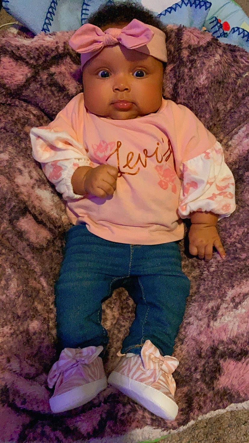 Kenzlee is registered to the contest to win money with this photo: baby, baby_toddler_clothing, cap, child, eye, face, fawn, fun, happy, headwear, human, human_body, people, people_in_nature, person, pink, sitting, skin, sleeve, soil