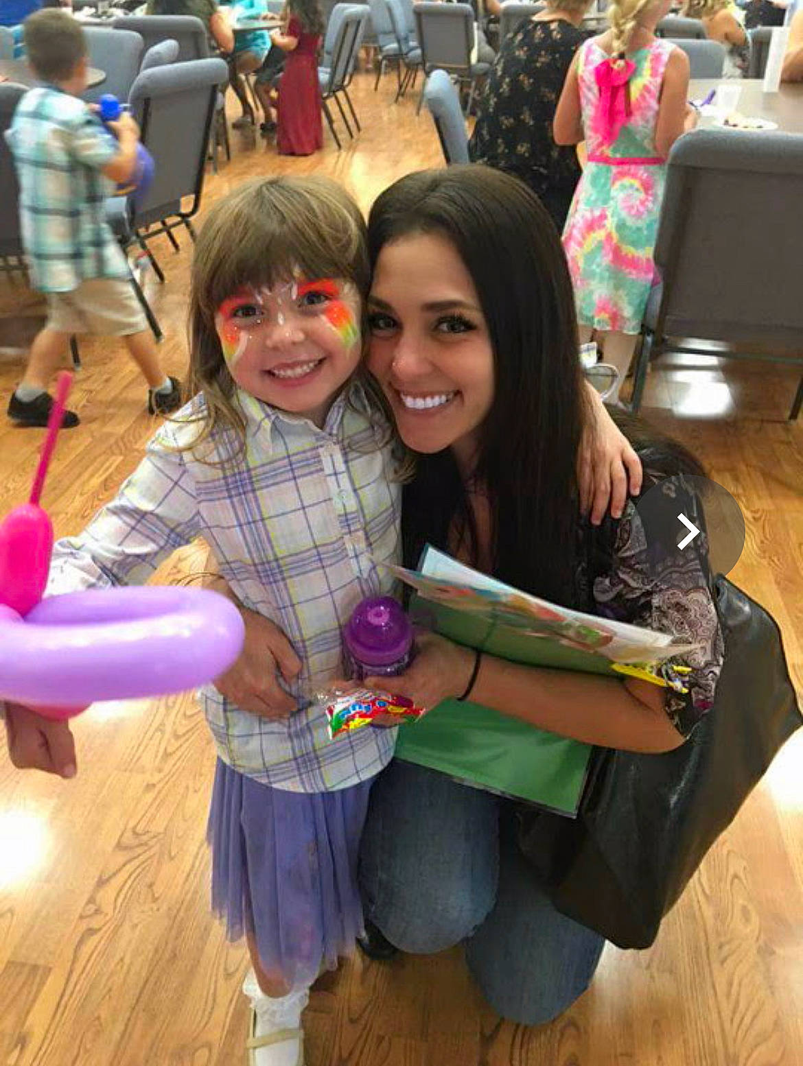 Adrianna is registered to the contest to win money with this photo: bag, chair, child, event, fun, handbag, happy, head, human_body, joy, leisure, luggage_and_bags, magenta, person, purple, recreation, skin, smile, sneakers, social_group