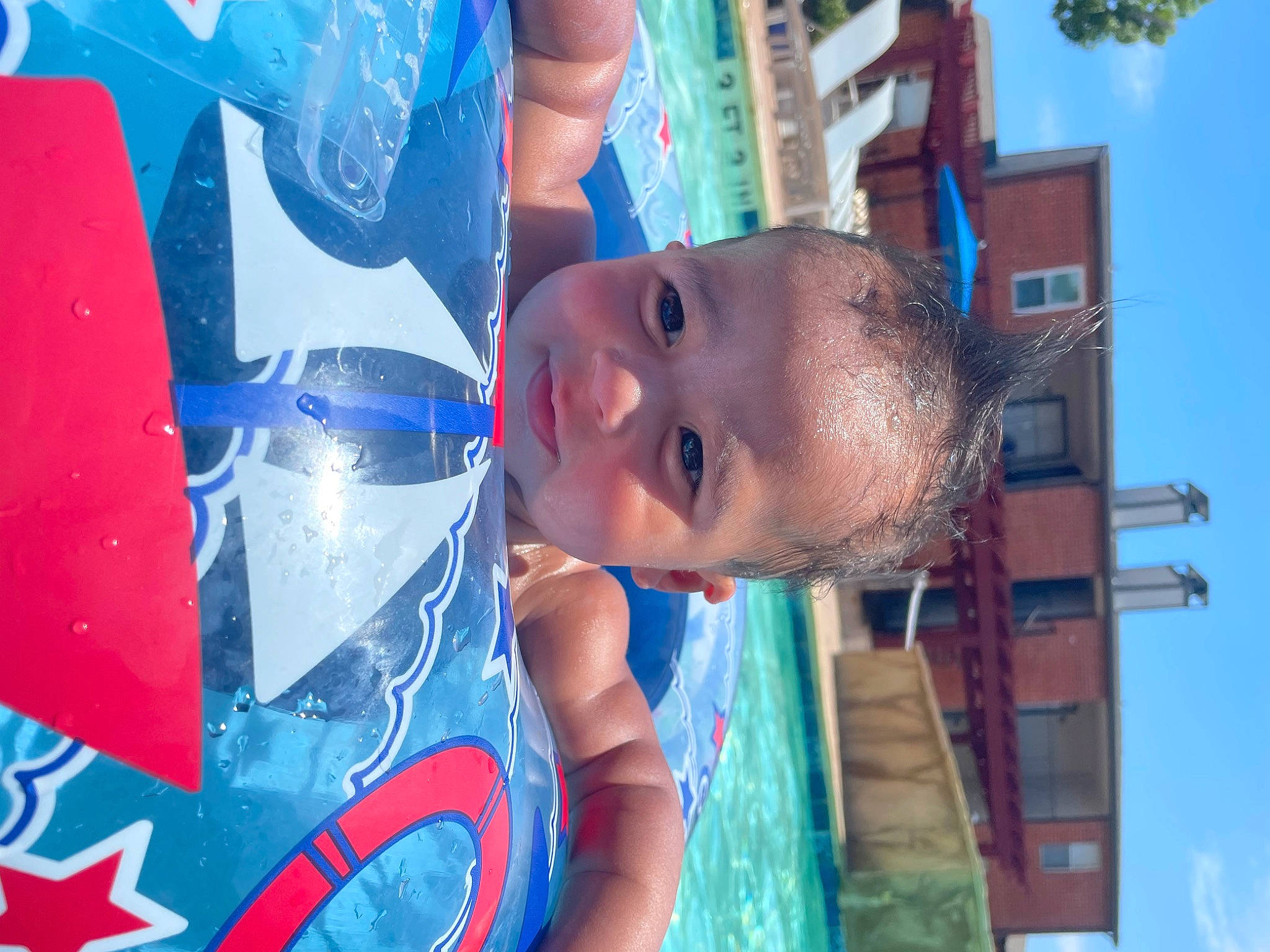 Camden is registered to the contest to win money with this photo: azure, blue, child, city, electric_blue, fun, happy, leisure, mouth, mural, pattern, person, play, recreation, sky, smile, t_shirt, toddler, vacation, water