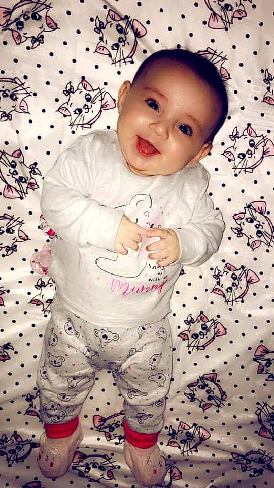 Arilah is registered to the contest to win money with this photo: baby, baby_toddler_clothing, beauty, cheek, child, cool, eye, forehead, gesture, lip, mouth, nose, outerwear, pattern, person, pink, skin, sleeve, smile, toddler