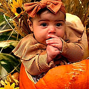 Sunniva is registered to the contest to win money with this photo: baby, child, pumpkin, headband, orange, flower, autumn, fall, cute, portrait, hands, nature, harvest, seasonal, outdoor, closeup, infant, yellow_flower, background, costume