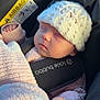 baby, infant, sleeping, hat, knit_hat, pink_clothing, blanket, car_seat, child, bundle, cozy, cute, peaceful, indoor, seatbelt, safety, portrait, soft_light, small_hands, resting