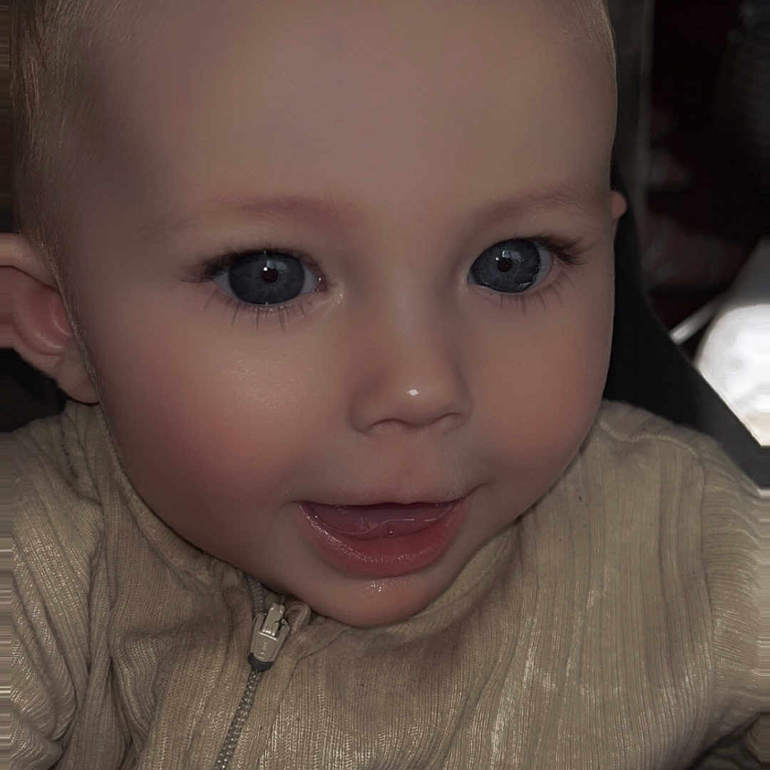 Sienna-Grace joined the competition — help win amazing prizes! baby, blue_eyes, bow, child, closeup, clothing, cute, face, hand, happy, head, indoor, infant, pacifier_clip, person, portrait, skin, smile, young, zipper