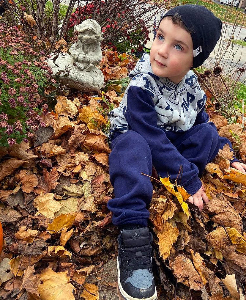 Luciano joined the competition — help win amazing prizes! boot, cool, deciduous, eye, grass, hair, happy, headwear, jacket, landscape, leaf, leg, people_in_nature, person, plant, shoe, sneakers, soil, street_fashion, toddler
