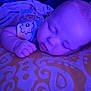 Lexi joined the competition — help win amazing prizes! baby, blanket, blue_light, child, closeup, comfort, cute, face, hand, indoors, infant, pattern, peaceful, person, pillow, purple_tint, resting, sleeping, soft_light, young