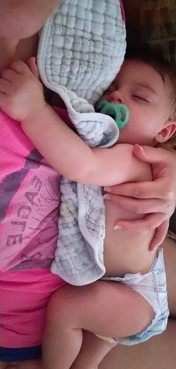 Kodi is registered to the contest to win money with this photo: arm, baby, baby_toddler_clothing, cap, cheek, comfort, finger, gesture, hand, human, human_body, mouth, nail, organ, person, pink, product, skin, thumb, toddler