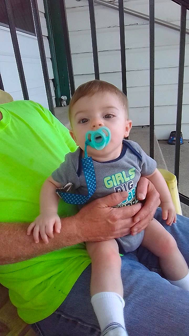 Kodi is registered to the contest to win money with this photo: baby, baby_products, baby_toddler_clothing, chair, cheek, child, comfort, event, facial_expression, fun, grass, happy, lap, leisure, person, sitting, t_shirt, thigh, toddler, vacation