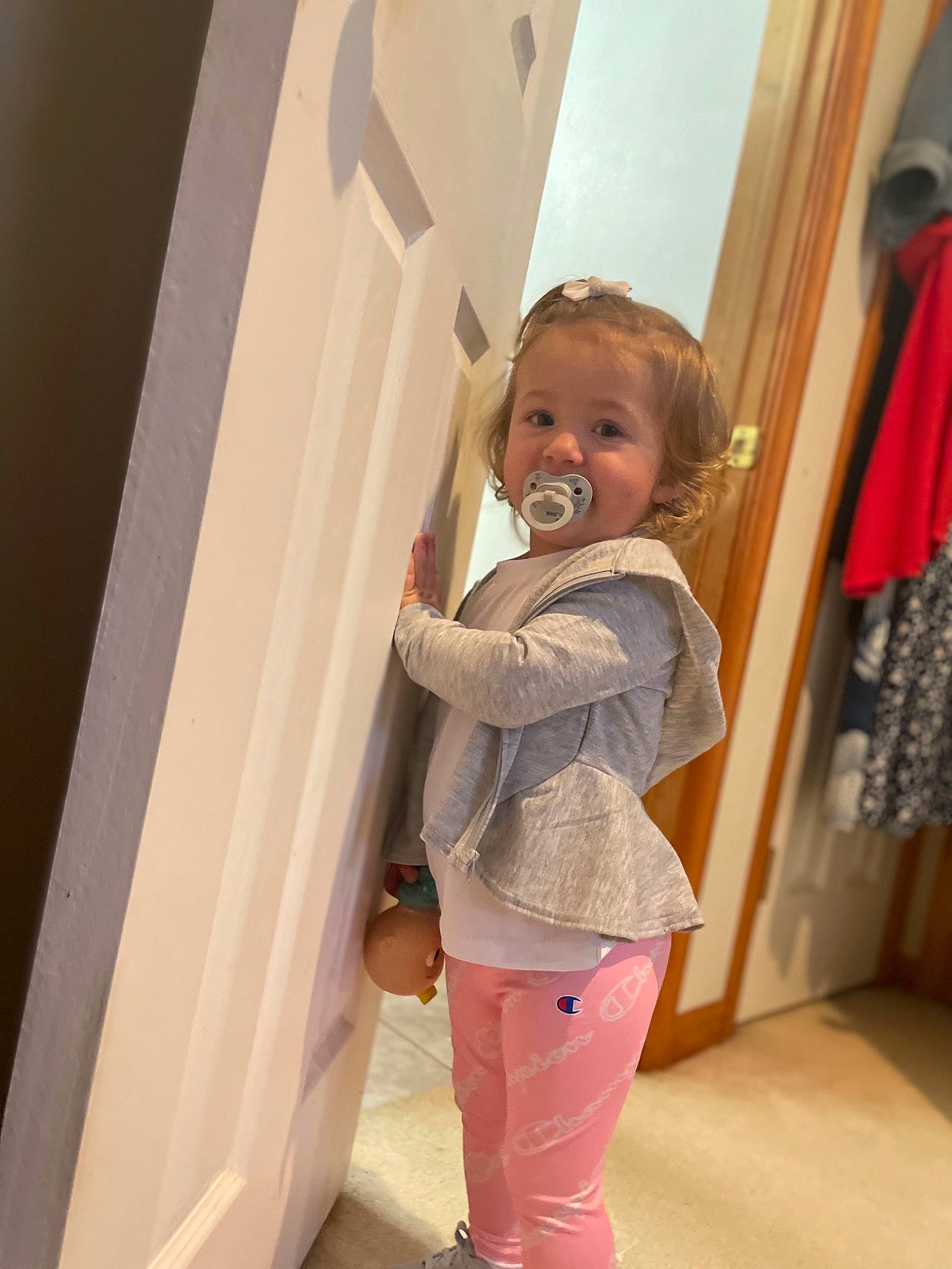 Adaleigh is registered to the contest to win money with this photo: baby_toddler_clothing, blond, child, fashion_design, flooring, fun, hardwood, human_leg, knee, magenta, pattern, peach, person, pink, plaster, room, sleeve, smile, toddler, waist