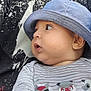 baby, child, hat, blue_hat, striped_shirt, cartoon, raccoon, face, profile, curious, cute, infant, person, portrait, clothing, pattern, black_and_white, close_up, young_child, casual