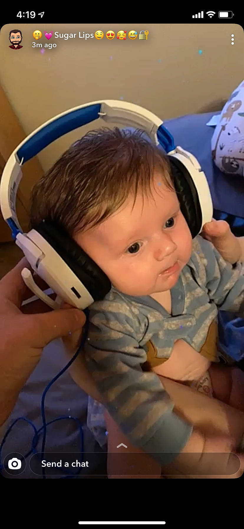 Alaric is registered to the contest to win money with this photo: audio_accessory, baby, baby_products, baby_safety, baby_toddler_clothing, child, curious, electronic_device, finger, gadget, hand, hearing, nail, overall, person, plastic, technology, thumb, toddler