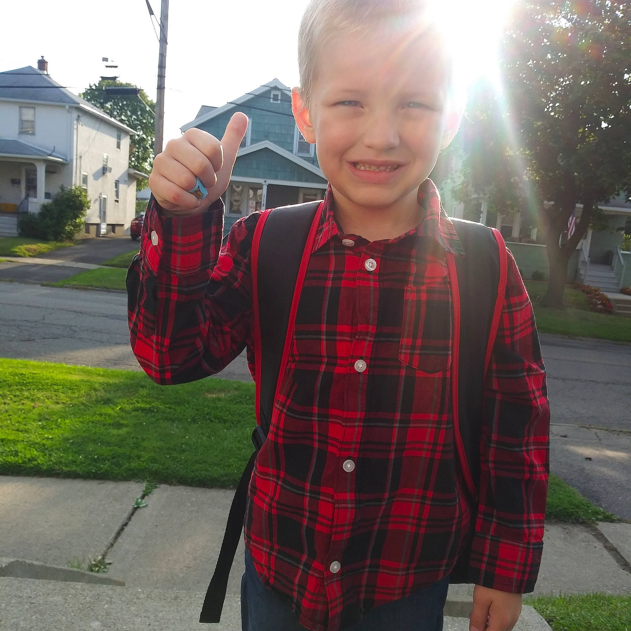Bentley is registered to the contest to win money with this photo: child, cool, design, finger, hand, jacket, joy, outerwear, pattern, person, photography, plaid, plant, sleeve, tartan, textile, toddler, tree