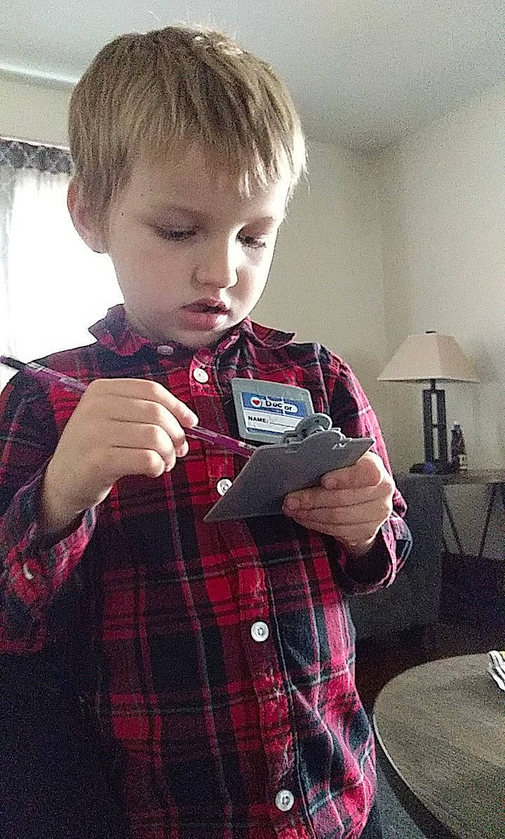 Bentley is registered to the contest to win money with this photo: child, design, electronic_device, gadget, pattern, person, plaid, tartan, technology, textile, toddler